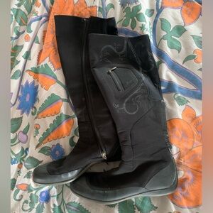 Salomon sleek black boots.  Soft shell material.  10.